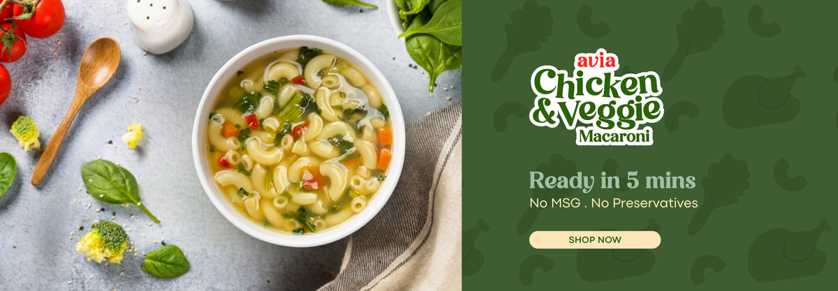 A bowl of macaroni surrounded by a spoon , vegetable and pepper with text "ready in 5 mins, no msg, no preservatives" on the side